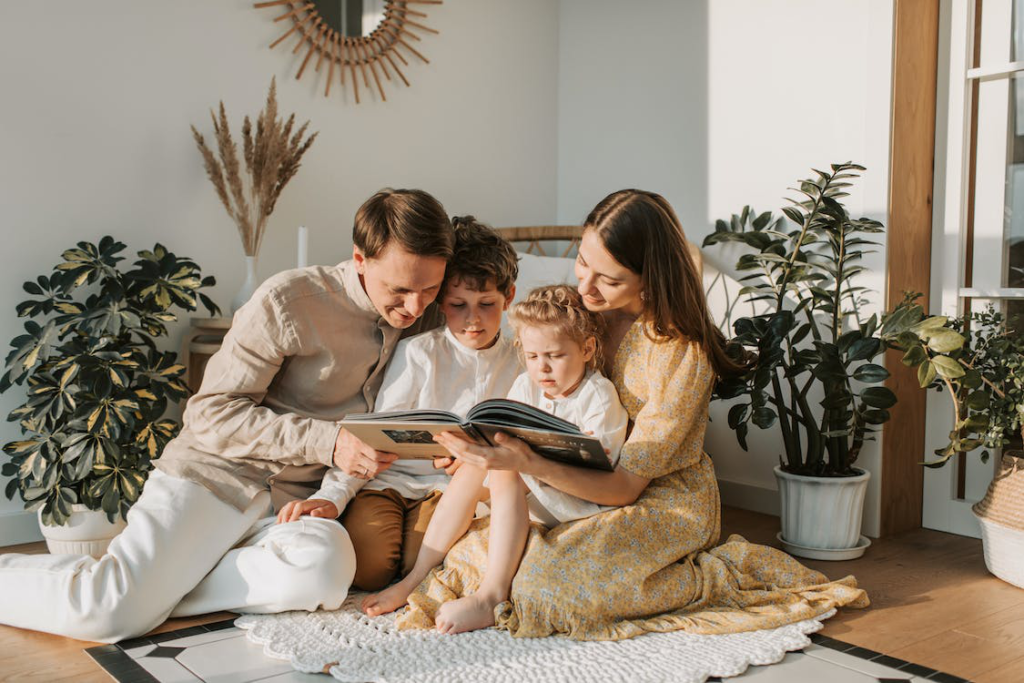 An image of a parents reading to their children