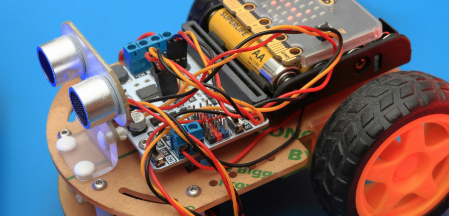 A snapshot of a robotics project, showcasing wheels, circuits, wires, and batteries - a prime example of engaging STEAM activities for children.
