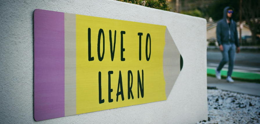 “Love to Learn” painted on a wall.