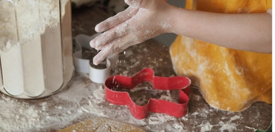 A child making gingerbread cookies.