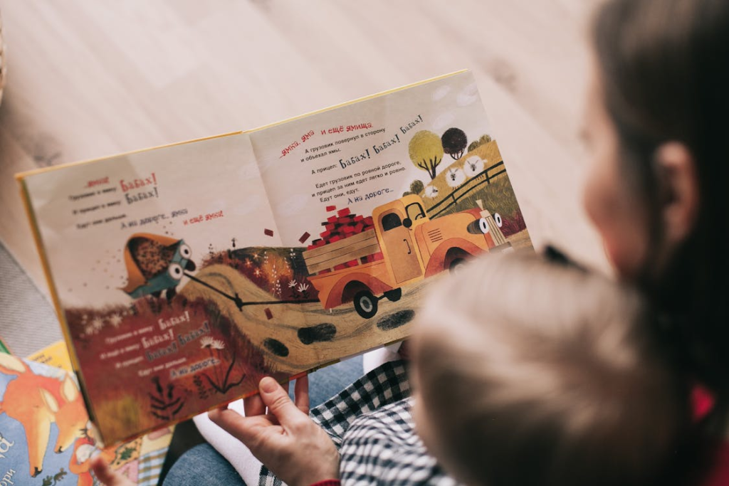 A mother encouraging independent reading in children.